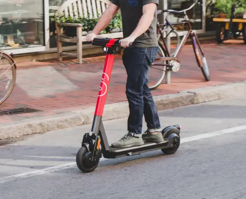 A scooter rider takes an autonomous maintenance scooter for a spin