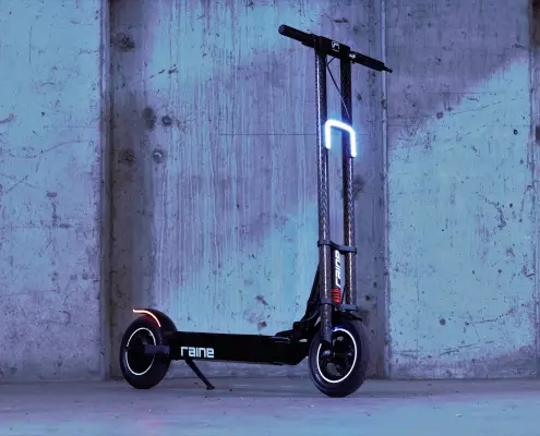 Raine electric scooter's carbon fiber neck is a dual threat of looks and strength..