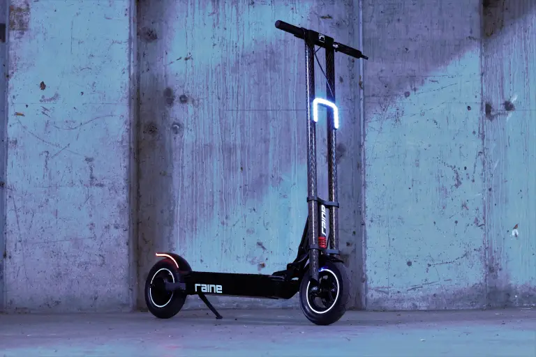 Raine electric scooter's carbon fiber neck is a dual threat of looks and strength..